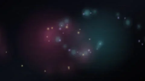 Abstract colorful bokeh particles floating on a dark background Stock Footage 335938934