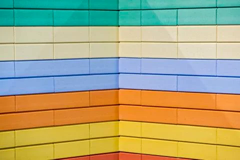 Abstract colorful brick wall pattern painted bricks urban texture background. Stock Photos