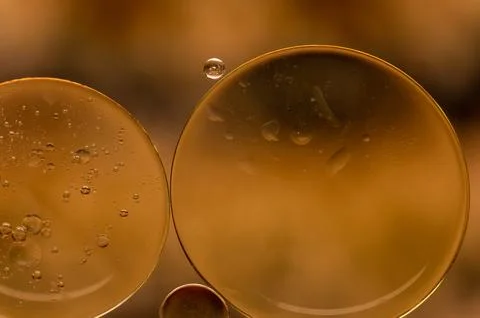 Abstract colorful bubbles. Soft background with gold and copper color circles. Stock Photos