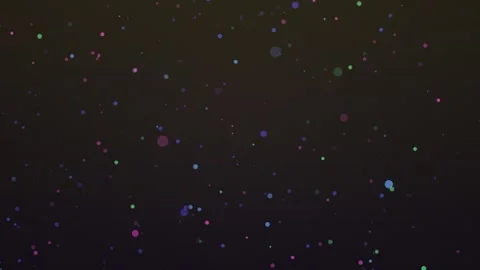 Abstract colorful dots float against a dark background, creating a dynamic and Stock Footage 327947170