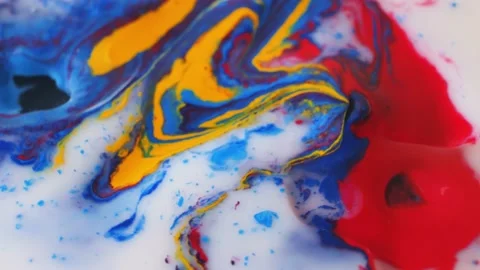 Abstract colorful paint on embossed surface mixes with liquid Stock Footage 171374167