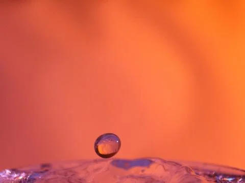 Abstract Colors colliding drops different fluids funds forms Stock Photos