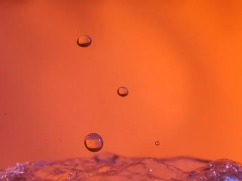 Abstract Colors colliding drops different fluids funds forms Stock Photos