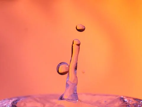 Abstract Colors colliding drops different fluids funds forms Stock Photos