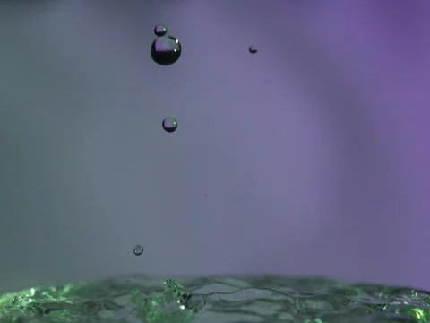 Abstract Colors colliding drops different fluids funds forms Stock Photos