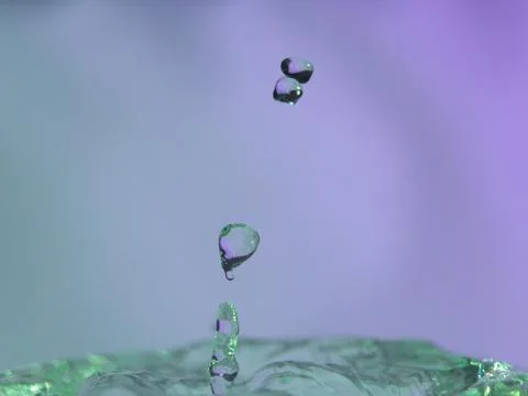 Abstract Colors colliding drops different fluids funds forms Stock Photos