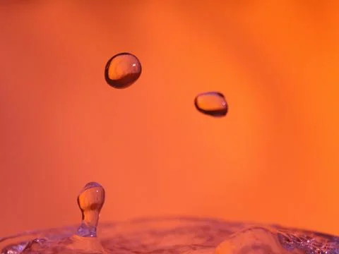 Abstract Colors colliding drops different fluids funds forms Stock Photos