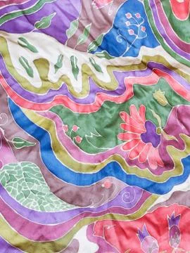 Abstract colour floral pattern on gray silk batik Stock Photos