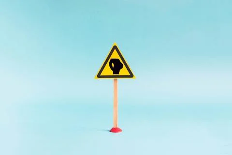 Abstract comic warning sign man with a big belly close-up Stock Photos