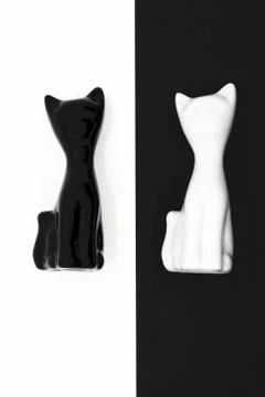 Abstract composition of black and white cat figurines Foto stock