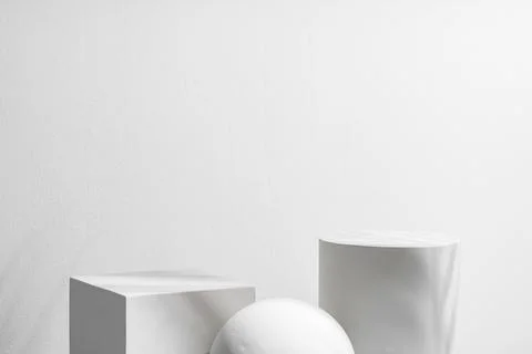 Abstract composition featuring three white geometric shapes in a minimalist Stock Photos