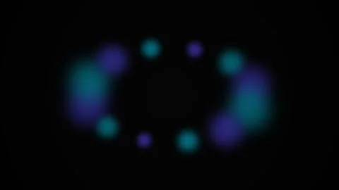 Abstract composition of glowing blue and purple bokeh circles on black Video stock 339614741