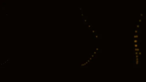Abstract composition of glowing orange dots on a deep black background Видео 338310786