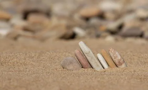 Abstract composition of pebbles on the beach, screensaver, background. wallpaper Stock Photos