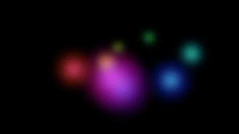 Abstract composition of soft colorful glowing light orbs on a black background Video stock 335117228