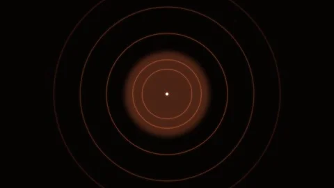 Abstract concentric golden rings emanating from a central glowing white point Video stock 338311993