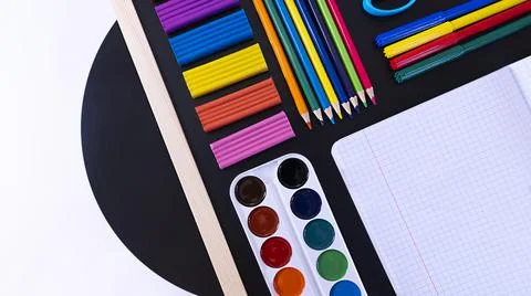 Abstract Concept back to school, school supplies on black chalkboard, top view Stock Photos