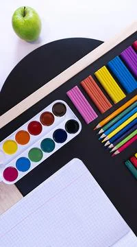 Abstract Concept back to school, school supplies on black chalkboard, top view Foto stock