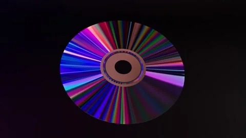 Abstract concept. CD DVD disc on a black isolated background. Neon blue purple Video stock 251539240