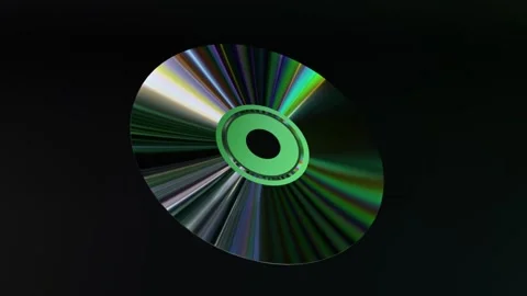 Abstract concept. CD DVD disc on a black isolated background. Neon blue green Video stock 251539344
