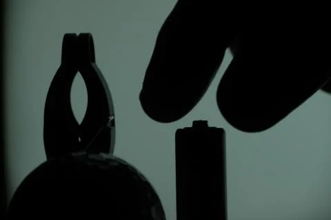 Abstract conceptual bodegon, backlit, clamp, hand and stack Stock Photos