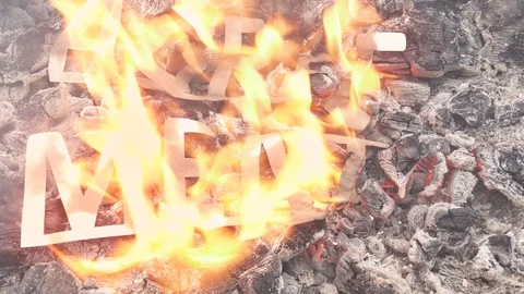 The abstract contract burns in the fire on hot coals. A sign of loss or end. Stock Footage 119072868