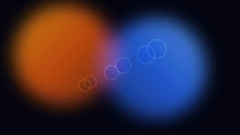Abstract contrast of glowing orange and blue spheres on black background Видео 338310080