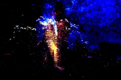 Abstract cosmic composition of glowing orange-blue human silhouette made Stock Photos