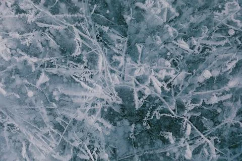 Abstract cracked winter ice texture on Lake Baikal surface, natural background 스톡 사진