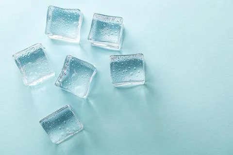 Abstract creative background with ice cubes and water drops. Stock Photos