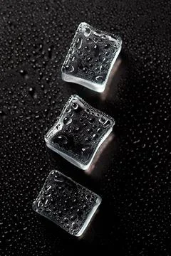 Abstract creative background with ice cubes and water drops. Stock Photos