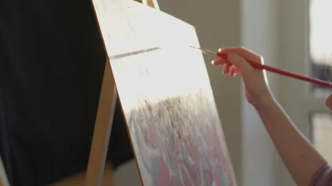 Abstract creativity in an art studio. A colorful palette, creative tools, and an Video stock 257908736