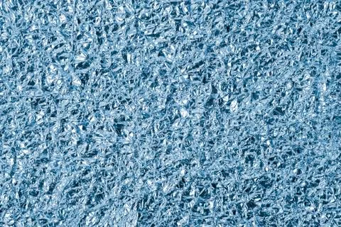 Abstract crumpled foil background texture Stock Photos