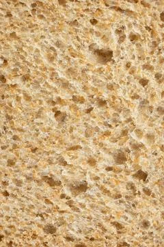 Abstract culinary backdrop of organic grain toast bread texture. Stock Photos