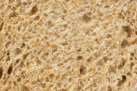 Abstract culinary backdrop of organic grain toast bread texture. Stock Photos