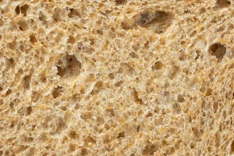 Abstract culinary backdrop of organic grain toast bread texture. Stock Photos