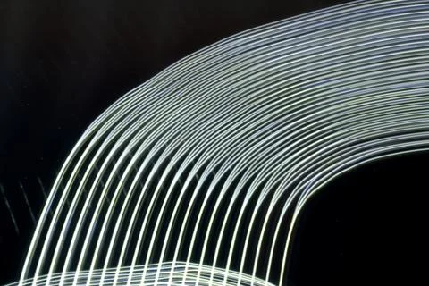Abstract curved white light lines. Stock Photos