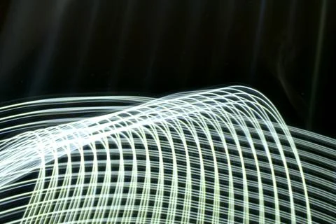 Abstract curved white light lines. Stock Photos