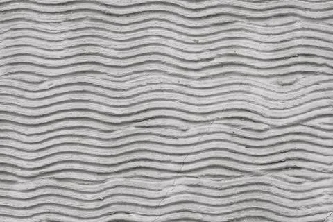 Abstract curvy cement pattern with waves on a plastered wall. Creative backgr Stock Photos