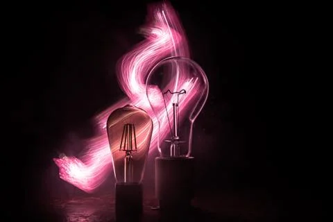 Abstract dark background with creative artwork decoration of glowing bulbs. Foto stock