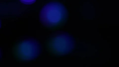 Abstract dark background with defocused blue and purple bokeh light circles.. Stock Footage 334285549