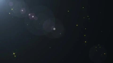 Abstract dark background featuring glowing golden particles and radiant lens Stock Footage 345333007