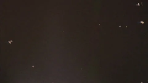 Abstract Dark Background with Flecks of Light and Dust Particles Moving Slowl Stock Footage 337228355