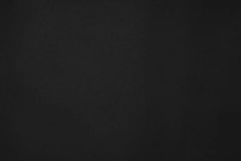 Abstract dark background: a large sheet of black paper Stock Photos