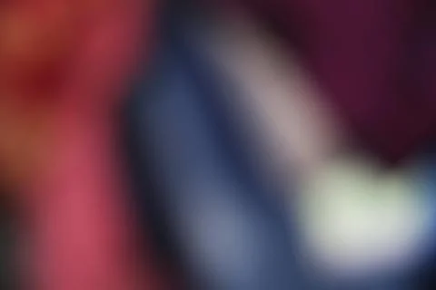 Abstract dark background with soft blurred gradients of red blue and purple.. Stock Photos