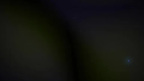 Abstract dark background with subtle light flares and bokeh effects. Видео 334431220