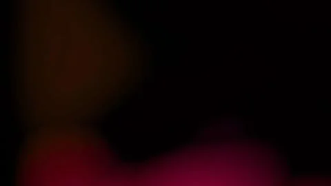 Abstract dark background with vibrant red and orange bokeh lights. Moody gradien Vídeo Stock 334313993