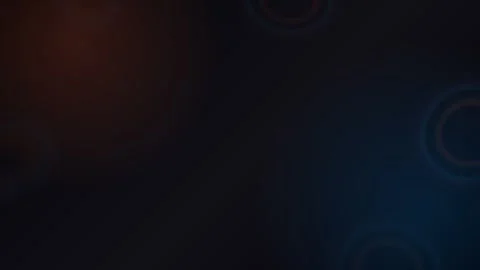 Abstract dark background with warm and cool lens flare rings Stock Footage 335884168