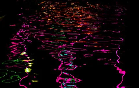 Abstract dark background with wavy neon lines. Stock-Fotos