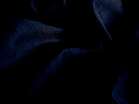 Abstract dark blue textured surface with subtle highlights. Stock Photos